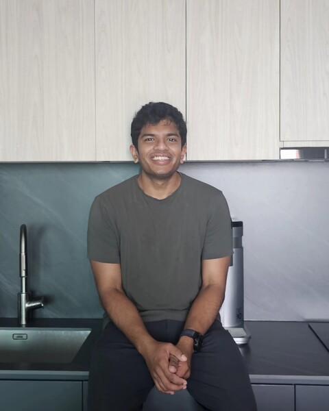 A recent picture of me in our kitchen, smiling at the camera.